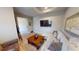 This home's living room features an accent wall and an entertainment space with an expansive sectional sofa at 17350 Bayharbor Cir, Port Charlotte, FL 33948