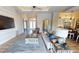 Living room with a view of the open floor plan, including the kitchen, sliding glass doors, and foyer at 17350 Bayharbor Cir, Port Charlotte, FL 33948