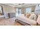Comfortable main bedroom with ceiling fan, ensuite bathroom, walk out to the pool, and tile flooring at 17350 Bayharbor Cir, Port Charlotte, FL 33948