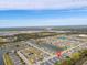Aerial view showing home location in a community with lake and other houses at 1890 Sunset Preserve Way, Port Charlotte, FL 33953