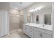 Bathroom with double vanity and large shower at 1890 Sunset Preserve Way, Port Charlotte, FL 33953