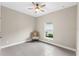Bright bedroom featuring tile floors and a ceiling fan at 1890 Sunset Preserve Way, Port Charlotte, FL 33953