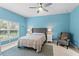 Bedroom with a ceiling fan and en-suite bathroom at 1890 Sunset Preserve Way, Port Charlotte, FL 33953