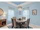 Elegant dining room with a round table and four chairs at 1890 Sunset Preserve Way, Port Charlotte, FL 33953