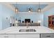 Modern kitchen island with a double sink and white quartz countertop at 1890 Sunset Preserve Way, Port Charlotte, FL 33953