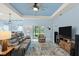 Spacious living room with recessed ceiling and view to kitchen at 1890 Sunset Preserve Way, Port Charlotte, FL 33953