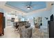 Open living room with access to kitchen and backyard at 1890 Sunset Preserve Way, Port Charlotte, FL 33953