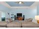 Spacious living room featuring comfortable seating and a large TV at 1890 Sunset Preserve Way, Port Charlotte, FL 33953