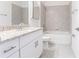 Well-lit bathroom with a tub and tiled shower, vanity with granite counters at 1912 Saddlewood Cir, Port Charlotte, FL 33953