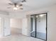 Bright bedroom featuring double doors and access to the tiled patio at 1912 Saddlewood Cir, Port Charlotte, FL 33953