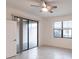This bright bedroom has tiled floors and sliding glass door access to the patio at 1912 Saddlewood Cir, Port Charlotte, FL 33953