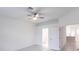 Spacious bedroom with neutral walls, ceiling fan, and tiled floors at 1912 Saddlewood Cir, Port Charlotte, FL 33953