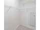 Spacious closet with installed white shelving and tile flooring at 1912 Saddlewood Cir, Port Charlotte, FL 33953