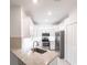 Modern kitchen features stainless steel appliances and a large sink at 1912 Saddlewood Cir, Port Charlotte, FL 33953