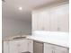 Bright kitchen features tile flooring, stainless steel appliances, and recessed lighting at 1912 Saddlewood Cir, Port Charlotte, FL 33953