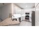Modern kitchen featuring white cabinetry, stainless steel appliances, and granite countertops at 1912 Saddlewood Cir, Port Charlotte, FL 33953