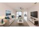 Bright living room with tile floors, contemporary furniture, and a sliding door for natural light at 1912 Saddlewood Cir, Port Charlotte, FL 33953