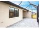 Screened lanai featuring pavers and an exterior view at 1912 Saddlewood Cir, Port Charlotte, FL 33953