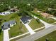 Birds-eye view showcases the home's position in a lush, green neighborhood at 2143 S Haberland Blvd, North Port, FL 34288