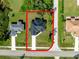 An aerial view of a single Gathering home with a dark roof, sidewalk, and lawn at 2143 S Haberland Blvd, North Port, FL 34288