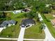 An aerial view showcasing the home's position in a lush, green neighborhood at 2143 S Haberland Blvd, North Port, FL 34288