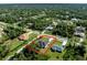 An aerial view of homes with dark roofs in a tree-lined residential neighborhood at 2143 S Haberland Blvd, North Port, FL 34288