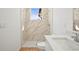 Bathroom features a marble-tiled walk-in shower and a vanity with quartz countertop at 2143 S Haberland Blvd, North Port, FL 34288