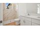 Bathroom features a marble-tiled shower and a vanity with quartz countertop at 2143 S Haberland Blvd, North Port, FL 34288