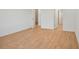 Bedroom features wood floors, closet, en suite bathroom and bright natural light at 2143 S Haberland Blvd, North Port, FL 34288