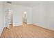 Bedroom features wood floors with easy access to closet space and an en suite bathroom at 2143 S Haberland Blvd, North Port, FL 34288