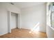 Bedroom featuring a closet, bright walls, and wood-look floors at 2143 S Haberland Blvd, North Port, FL 34288