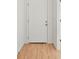 Bright entryway features a front door with wood-look flooring at 2143 S Haberland Blvd, North Port, FL 34288