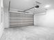 Spacious two car garage with light walls and concrete flooring at 2143 S Haberland Blvd, North Port, FL 34288