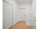 Bright laundry area showcasing a white utility sink, closet, and neutral paint at 2143 S Haberland Blvd, North Port, FL 34288