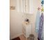 Bathroom showcasing a vanity with drawers, medicine cabinet, and colorful beach-themed accessories at 21535 Edgewater Dr, Port Charlotte, FL 33952