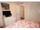 Bedroom featuring a decorative bedspread, closet, and dresser; light and airy at 21535 Edgewater Dr, Port Charlotte, FL 33952