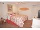 Inviting bedroom with coastal-themed decor, ceiling fan, and a queen-sized bed at 21535 Edgewater Dr, Port Charlotte, FL 33952
