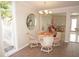 Cozy dining area featuring round table and chairs near a window, creating a warm space at 21535 Edgewater Dr, Port Charlotte, FL 33952