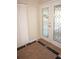 Well-lit foyer with a decorative glass front door, marble floors, and closet for storage at 21535 Edgewater Dr, Port Charlotte, FL 33952