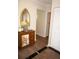 Inviting foyer with surfboard decor, wooden cabinet, closet and neutral walls creating a calming entry at 21535 Edgewater Dr, Port Charlotte, FL 33952