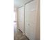 Hallway with closet space featuring white paneled doors at 21535 Edgewater Dr, Port Charlotte, FL 33952