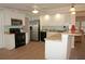 Kitchen includes stainless steel appliances, granite countertops, and convenient breakfast bar at 21535 Edgewater Dr, Port Charlotte, FL 33952
