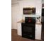 Modern kitchen features stainless steel oven and microwave over the range at 21535 Edgewater Dr, Port Charlotte, FL 33952