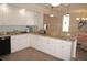 Kitchen features granite countertops, stainless steel dishwasher, and ample counter space at 21535 Edgewater Dr, Port Charlotte, FL 33952
