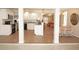 Open concept kitchen and dining area with tile flooring and white pillars at 21535 Edgewater Dr, Port Charlotte, FL 33952