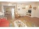 Inviting living area with nautical decor, tile flooring, and a view to the dining room at 21535 Edgewater Dr, Port Charlotte, FL 33952