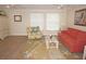 Bright living room with multiple ceiling fans, coastal decor, and neutral walls at 21535 Edgewater Dr, Port Charlotte, FL 33952