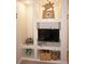 Close up of the living room entertainment center featuring a tv and coastal accents at 21535 Edgewater Dr, Port Charlotte, FL 33952