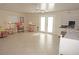 Bright living room featuring tile flooring, ceiling fan, and a cozy seating area at 21535 Edgewater Dr, Port Charlotte, FL 33952