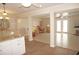 Living room with an open layout featuring tile flooring, ceiling fan, and access to the outside at 21535 Edgewater Dr, Port Charlotte, FL 33952
